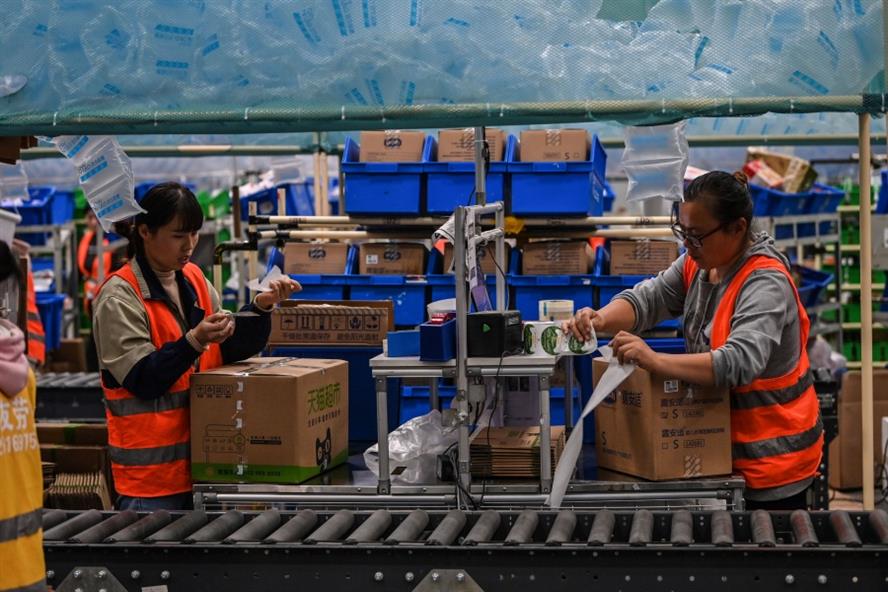 Employees at Cainiao Smart Logistics Network, the logistics affiliate of Alibaba, packaging orders ahead of the 11/11 shopping festival. (Getty Images)