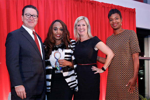 On behalf of Edelman, Smith (2nd l) and U.S. COO Julianna Richter (3rd l) receive 2016 Diversity Distinction in PR Award from judges Paul Capelli (l) and Tonya Veasey (r)