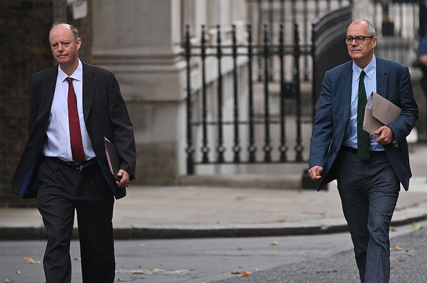 Grim faces as Professor Chris Whitty (L) and Sir Patrick Vallance (R) arrive at Downing Street yesterday to deliver a sobering briefing (Pic: Getty)