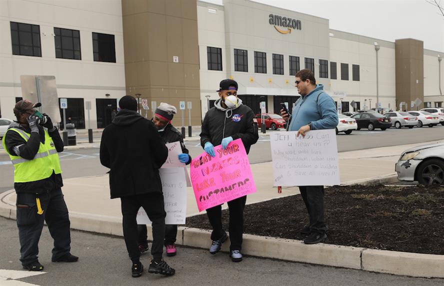 Amazon employees holding pro-union signs