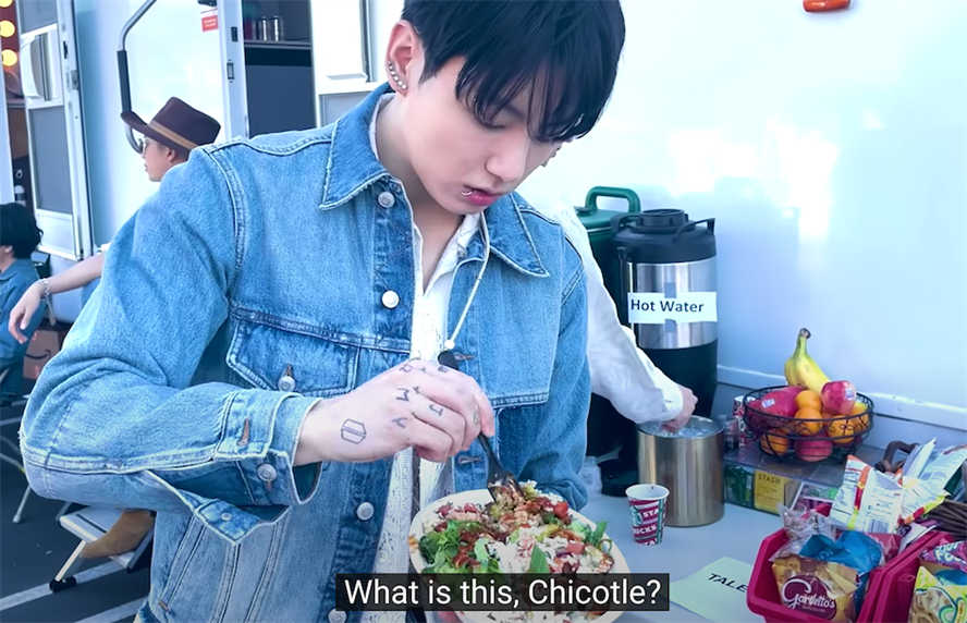 Screenshot of BTS member trying Chipotle for the first time