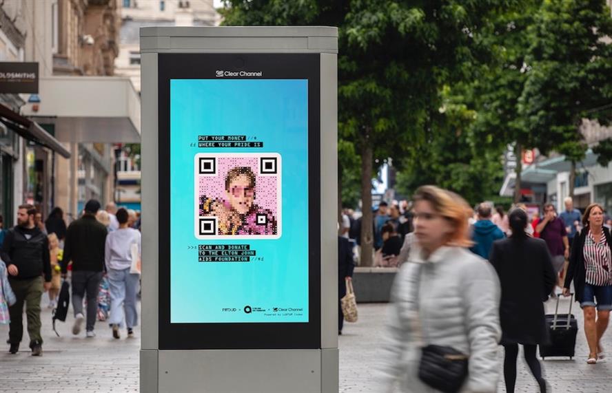 Elton John's face as a QR code on a bus shelter ad display unit