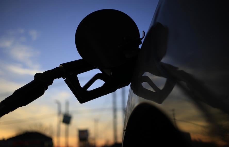 Gas station pump in car gas tank valve