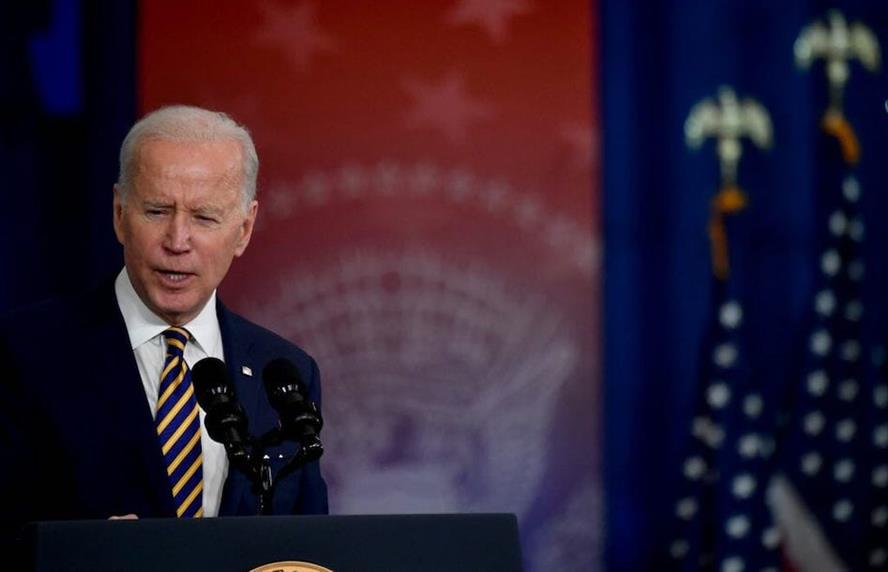 President Joe Biden delivers a speech from behind a podium