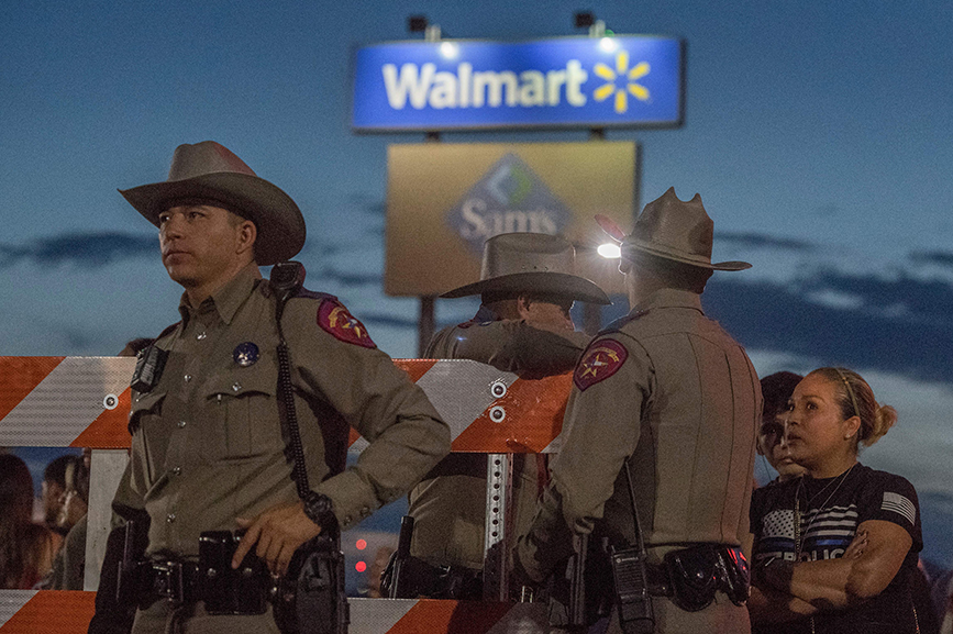 Texas State Troopers keep watch at a makeshift memorial for victims of the shooting that killed 22 at an El Paso, Texas WalMart in August. (MARK RALSTON/AFP via Getty Images)