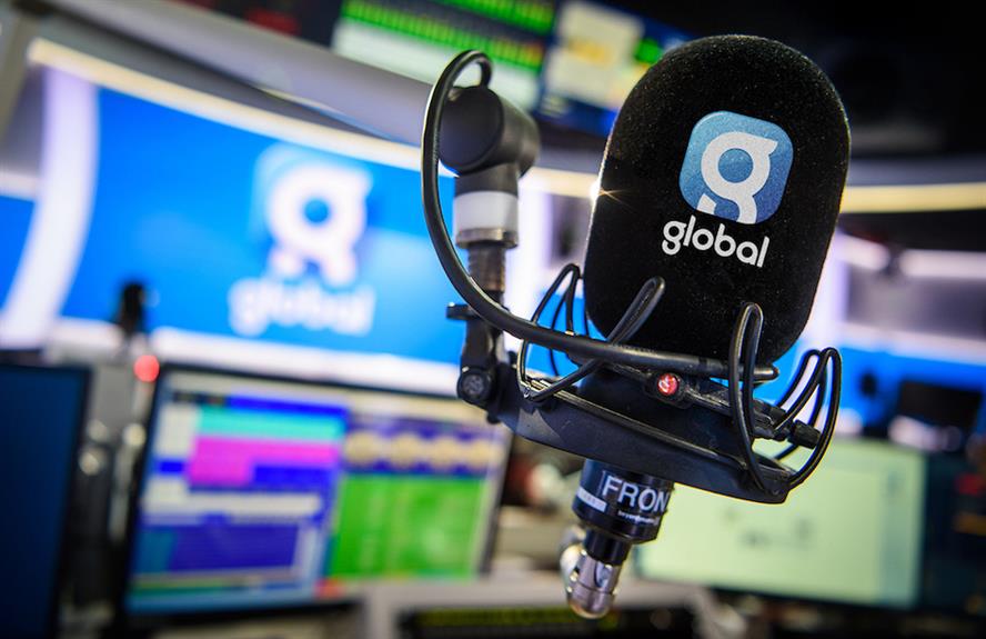 A microphone bearing the Global logo in a radio studio.