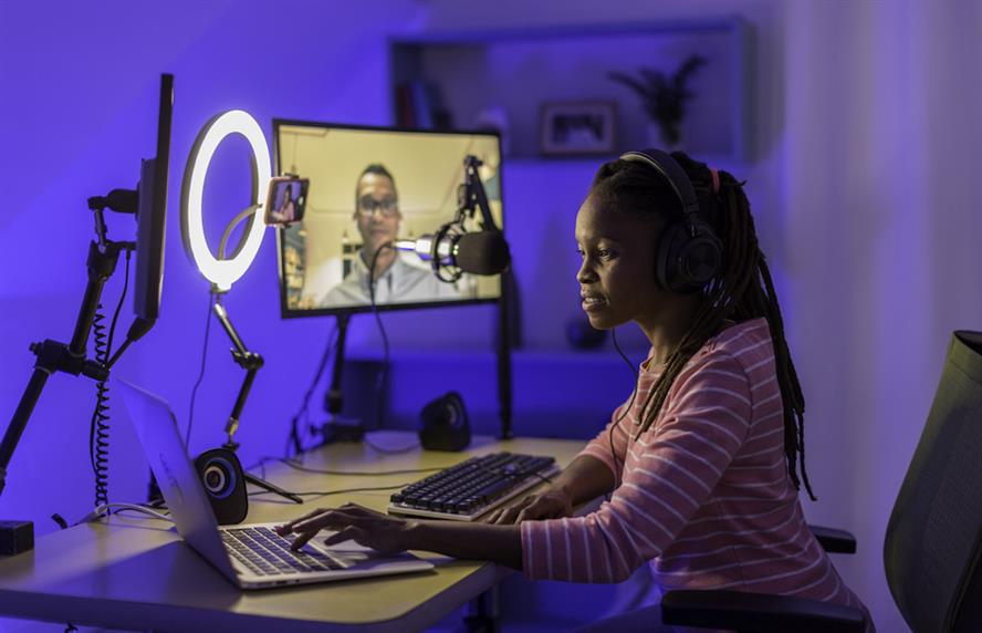 Black female influencer livestreaming on the internet