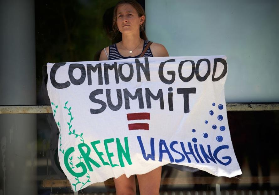 A protest by Extinction Rebellion France and ANV-COP21 against the Common Good Summit in May 2021 that featured the CEOs of ExxonMobil Europe and AXA France, among others (Photo by Alain Pitton/NurPhoto via Getty Images)