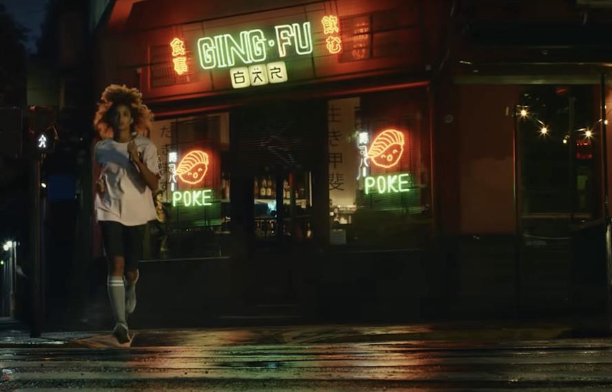Still from Samsung ad showing woman running alone at night