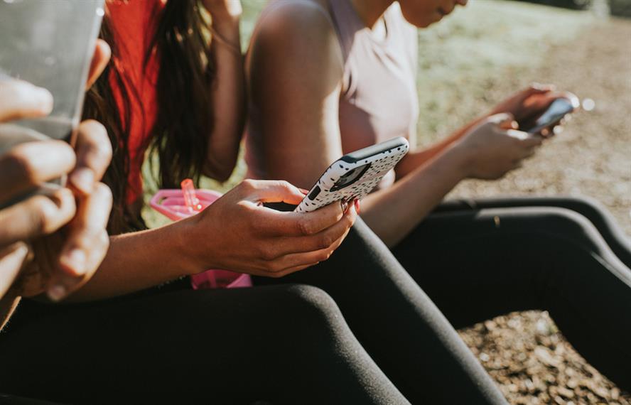 Stock art of young people using smartphones.