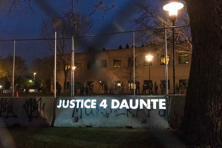 "Justice 4 Daunte" is projected near a police precinct in Brooklyn Center, Minnesota, this week. (Photo credit: Getty Images). 