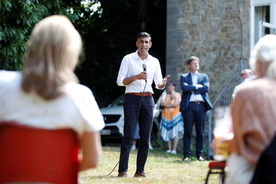Rishi Sunak at the event where he said he had started the process of diverting funds away from 'deprived urban areas' - with housing secretary Greg Clark in the background. Image: Getty