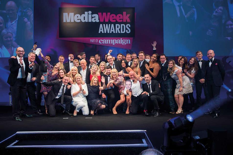Media Week Awards: ITV receives Sales Team of the Year award, led by Simon Daglish, deputy managing director of commercial (in red socks), holding a cut-out of Kelly Williams, managing director of commercial, who was unable to attend
