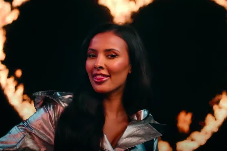 Picture of a woman in front of a burning heart